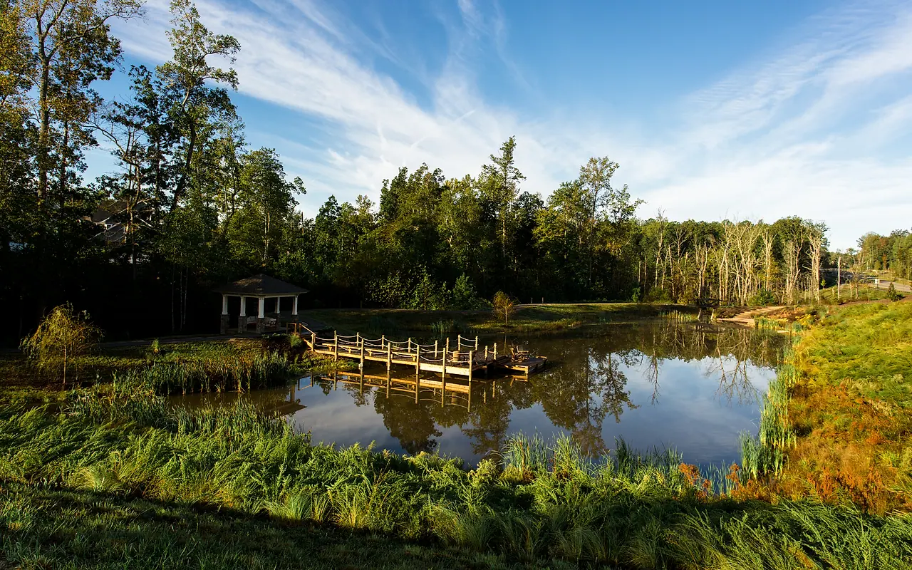 Tom Sawyer's Fishing Pond, gazebo, bridge, and wooded setting in Hallsley
