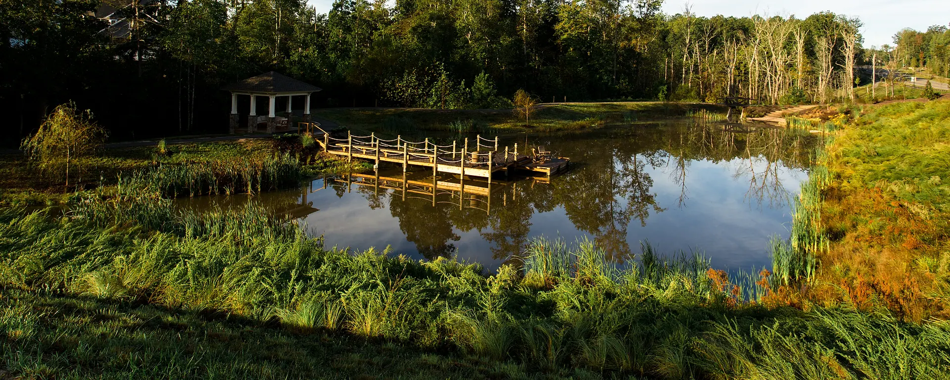Tom Sawyer's Fishing Pond, gazebo, bridge, and wooded setting in Hallsley
