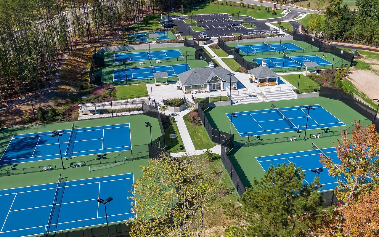 Aerial view of the Magnolia Green tennis center, clubhouse, paths, and woods