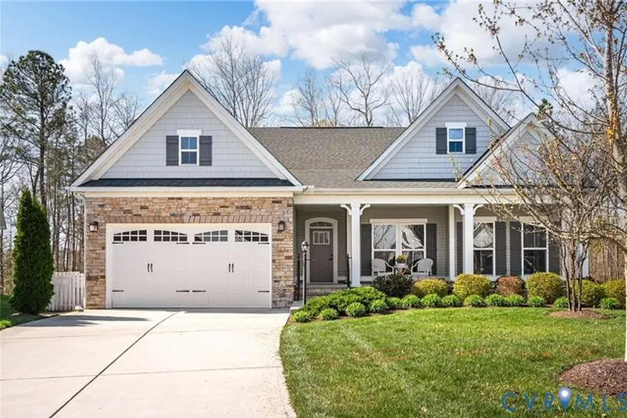 Front exterior of 17531 Great Falls Circle, a craftsman style home with stone accents