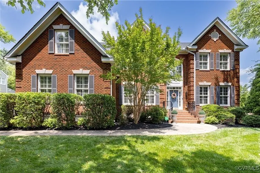 Front exterior of 14006 Riverdowns North Mews, a brick home in Midlothian
