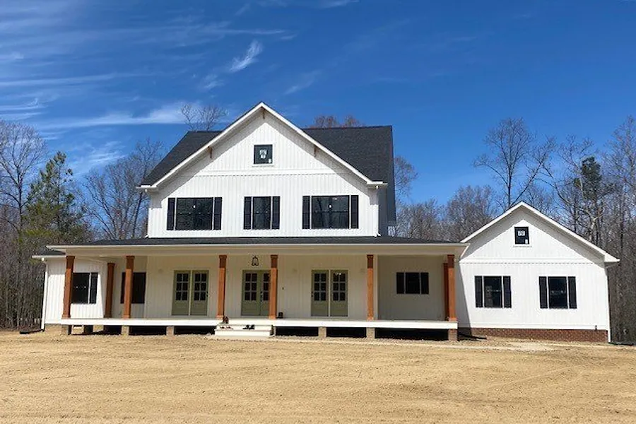 Front exterior of 9444 Wickham Crossing Way, a two storey home with a covered front porch